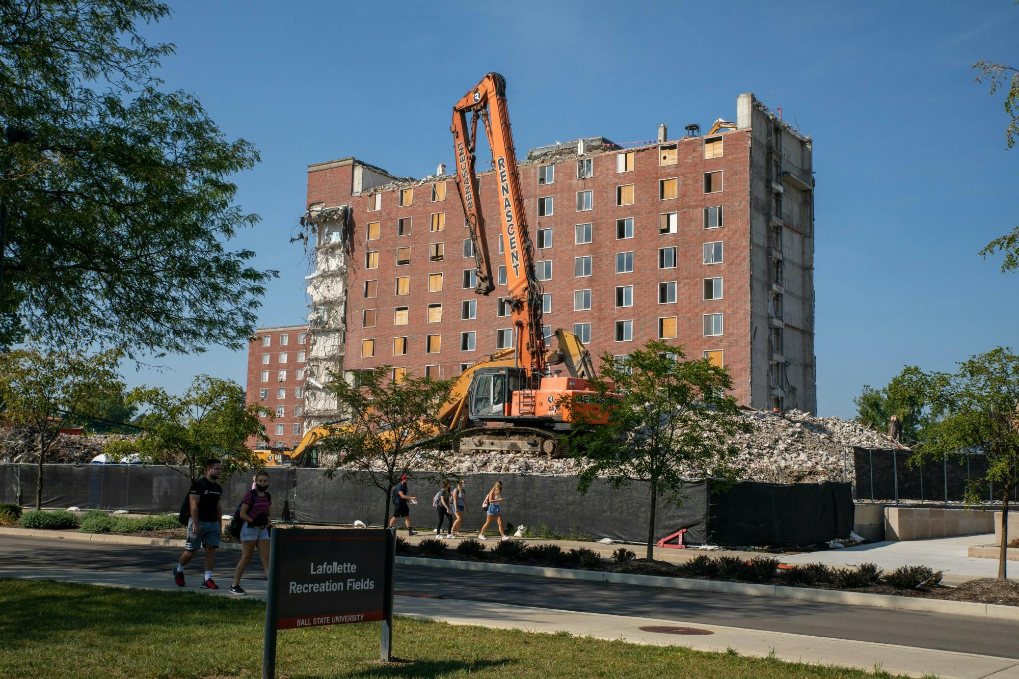 A Renascent mini excavator sits on top of a pile of rubble in front of the LaFollette Complex Sept. 8, 2020. Renascent workers have been demolishing LaFollette since summer 2017. Jaden Whiteman, DN