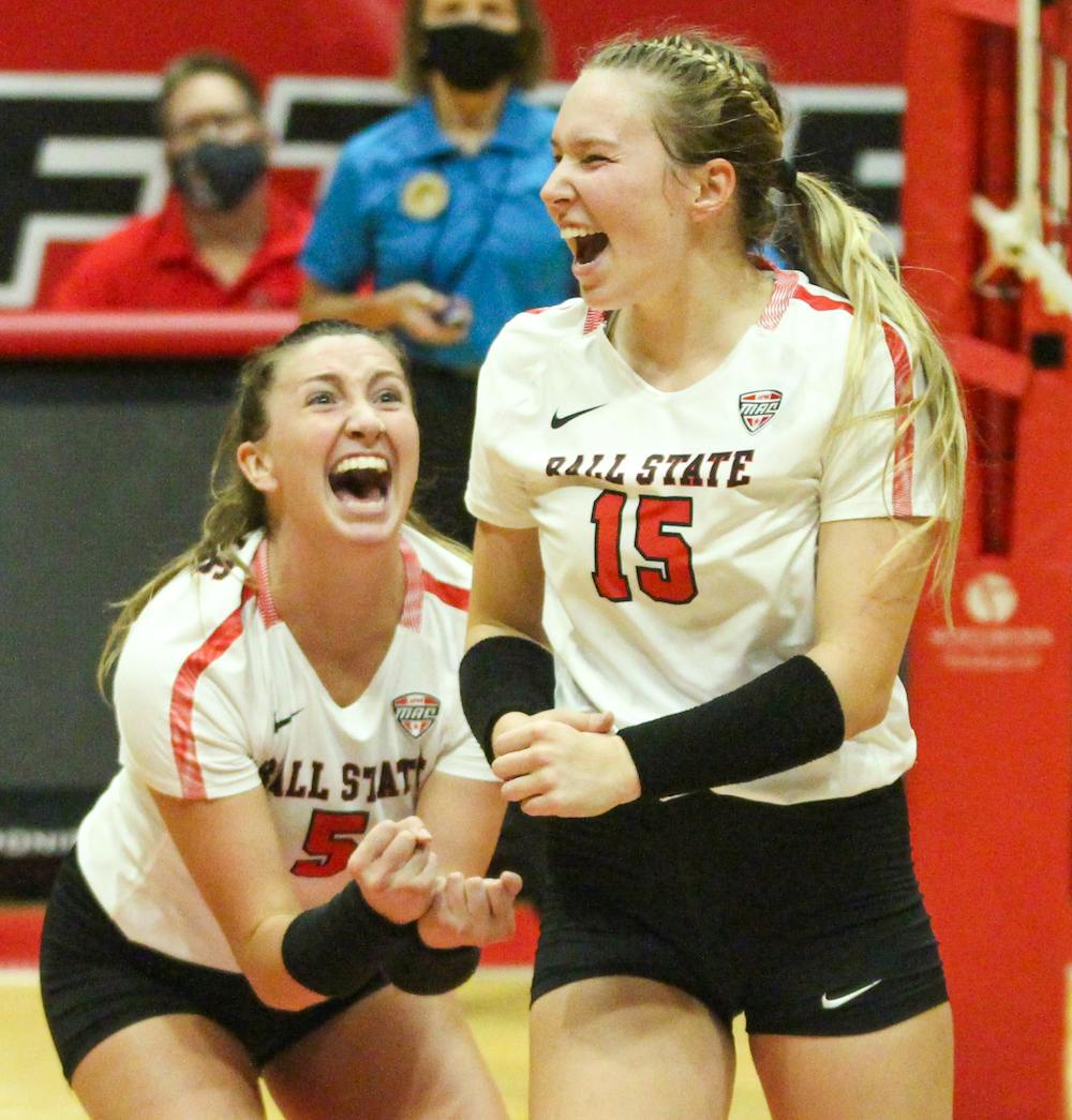 Freshman setter Megan Wielonski and junior middle blocker Marie Plitt celebrate a successful block by Wielonski against Northern Kentucky at Worthen Arena Sept. 17. Ball State had two challenges in the last set turned in its favor, one being the game-winning point. Jacy Bradley, DN