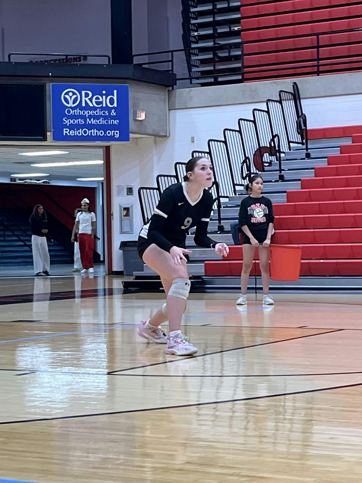 Junior Kendall Kahle on the court during the second set. Kahle scored a pair of aces and kills in the first set. PHOTO BY EVAN SHOTTS