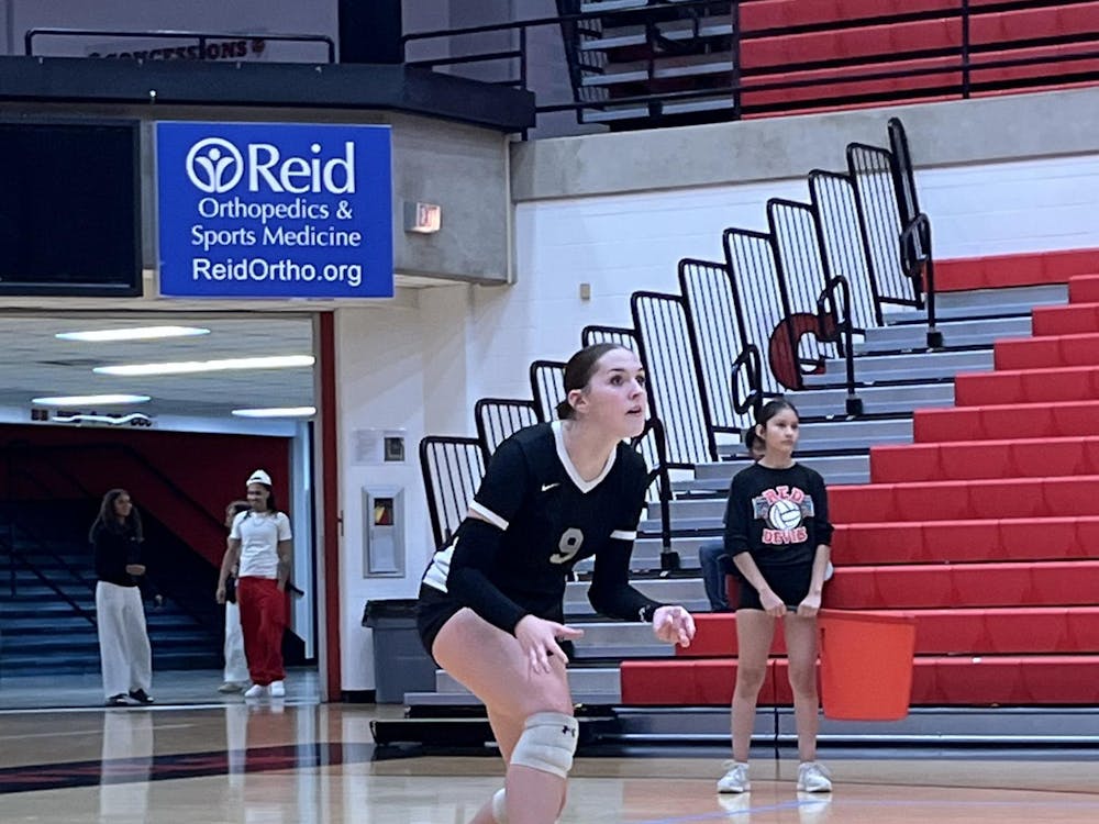 Junior Kendall Kahle on the court during the second set. Kahle scored a pair of aces and kills in the first set. PHOTO BY EVAN SHOTTS