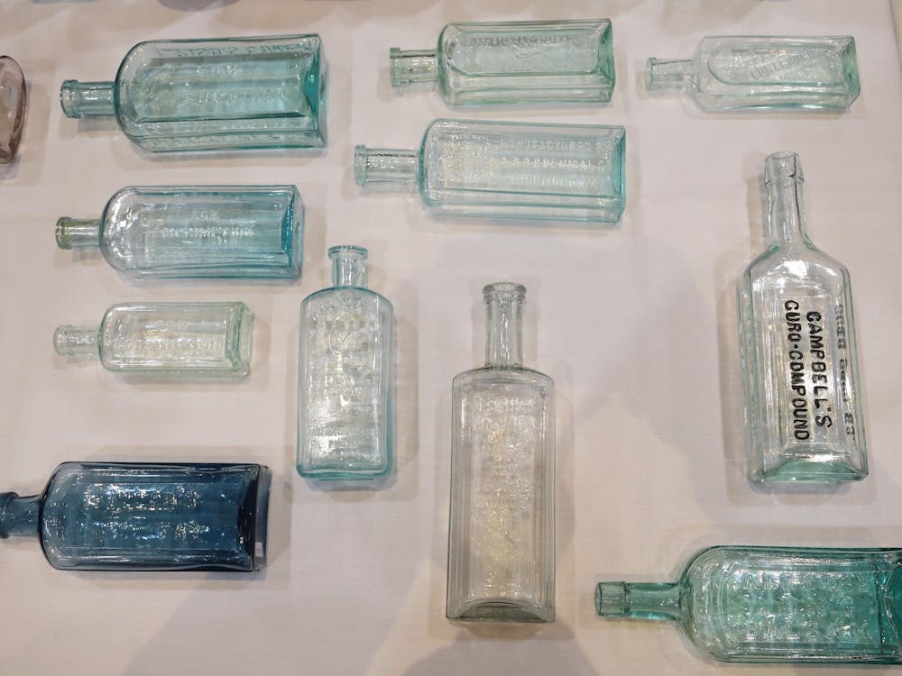 A collection of various medicinal glass jars are displayed at the closing trade show at The Midwest Antique Fruit Jar and Bottle Club – 2024 Convention at the Horizon Convention Center in Downtown Muncie Jan. 20. Olivia Ground, DN