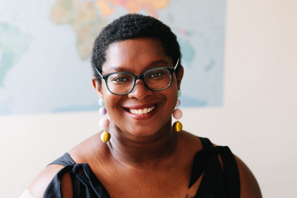 Ashley C. Ford poses for a headshot wearing colorful, dangling earrings. Ford’s memoir, “Somebody’s Daughter,” was labeled by Oprah Winfrey as “An Oprah Book” and made part of Winfrey’s book club. Ashley C. Ford, Photo Provided