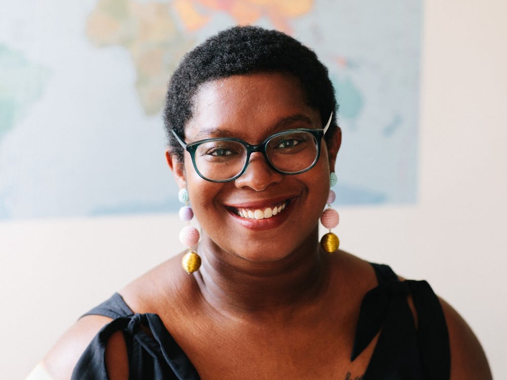 Ashley C. Ford poses for a headshot wearing colorful, dangling earrings. Ford’s memoir, “Somebody’s Daughter,” was labeled by Oprah Winfrey as “An Oprah Book” and made part of Winfrey’s book club. Ashley C. Ford, Photo Provided