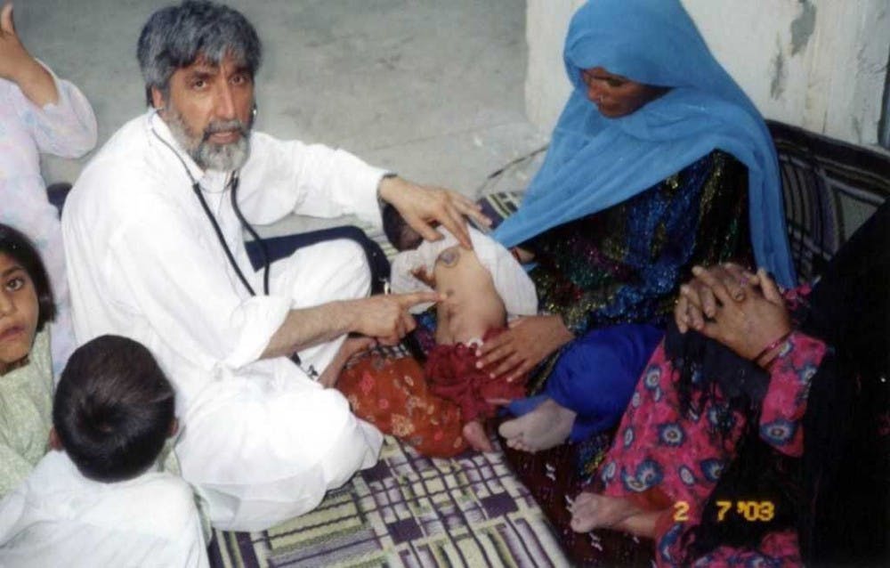 <p>Mohammad Saber Bahrami, husband of Bibi Bahrami, president of the Islamic Center and a doctor by profession, preforms surgery on a woman in Afghanistan. Muncie community members share their experiences in working in Afghanistan and what the future may hold for the &nbsp;country. <strong>Bibi Bahrami, Photo Provided</strong></p>