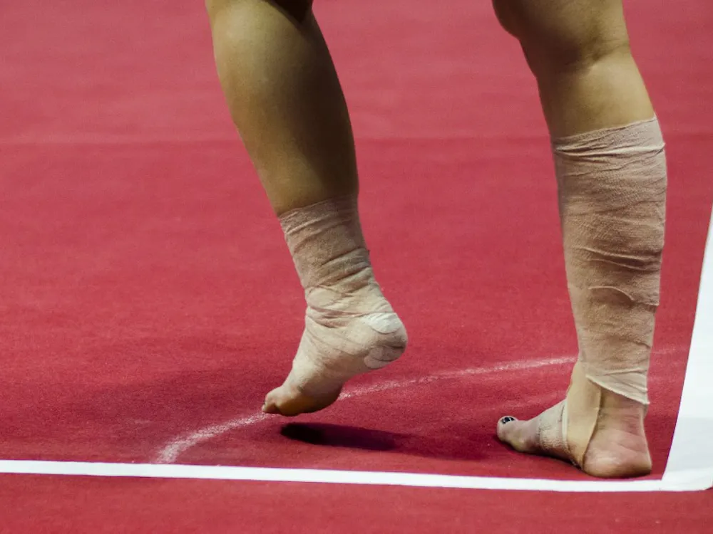 Junior Kayla Beckler prepares to perform a stunt in her floor routine during the meet against Eastern Michigan and Illinois State on Jan. 24 in Worthen Arena. DN PHOTO BREANNA DAUGHERTY