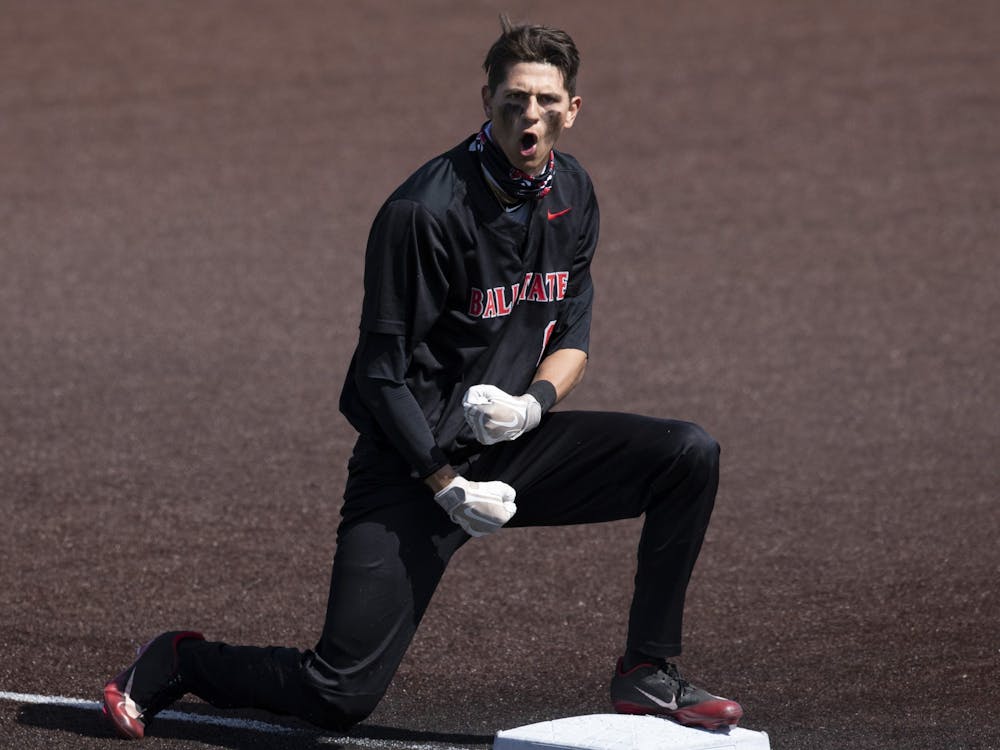 Cardinals freshman shortstop Adam Tellier celebrates making it to third after running from first off a hit March 21, 2021, at Ball Diamond at First Merchants Ballpark. The Cardinals lost to the Broncos 15-12 in 14 innings. Jacob Musselman, DN