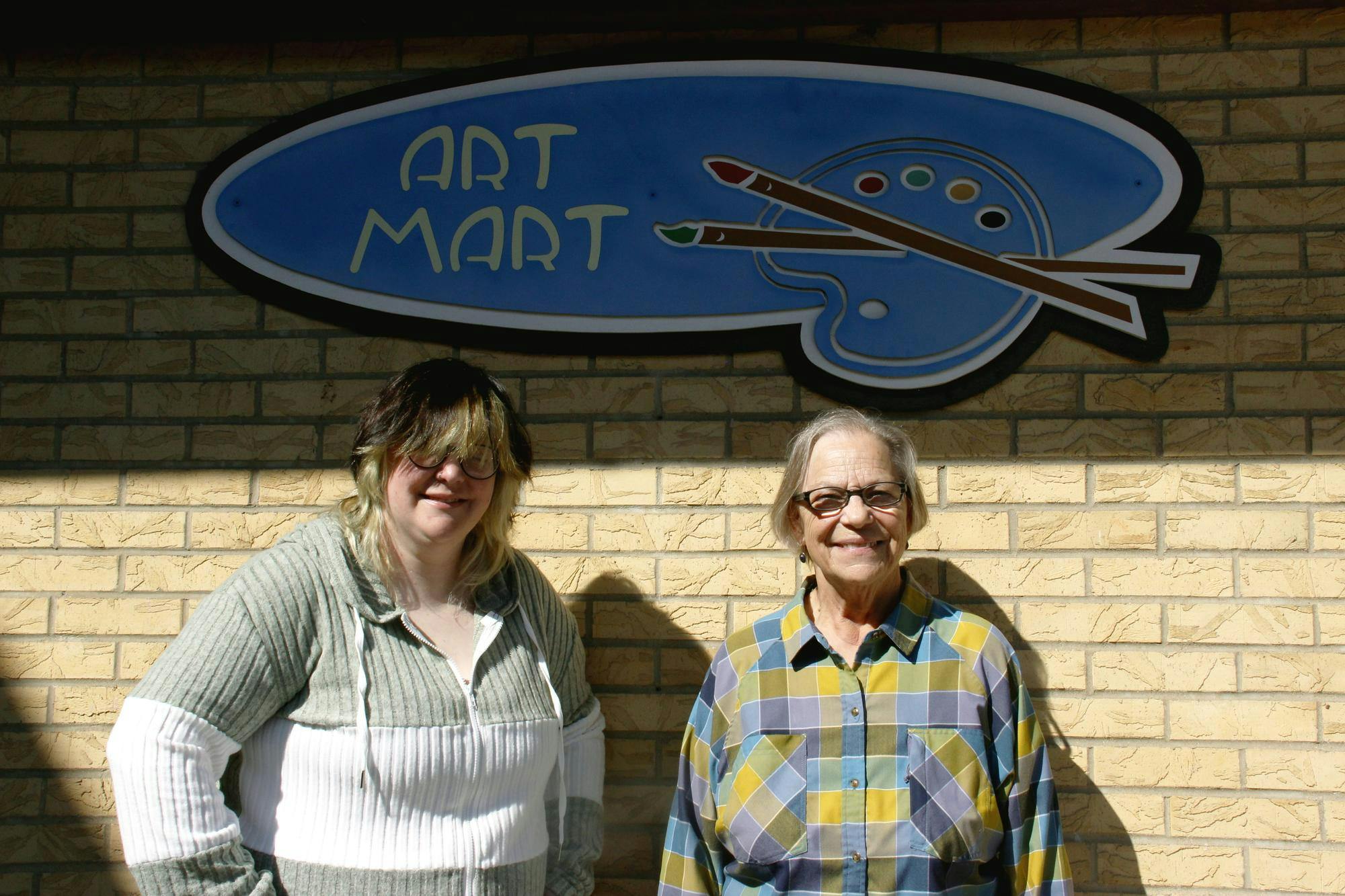 Art Mart owner Karen Fisher (right) and general manager Beth McCollum (left) pose for a picture Sept. 8 outside of Art Mart. The mother-daughter team said they have always bonded over their shared passion for art and creativity. Katherine Hill, DN