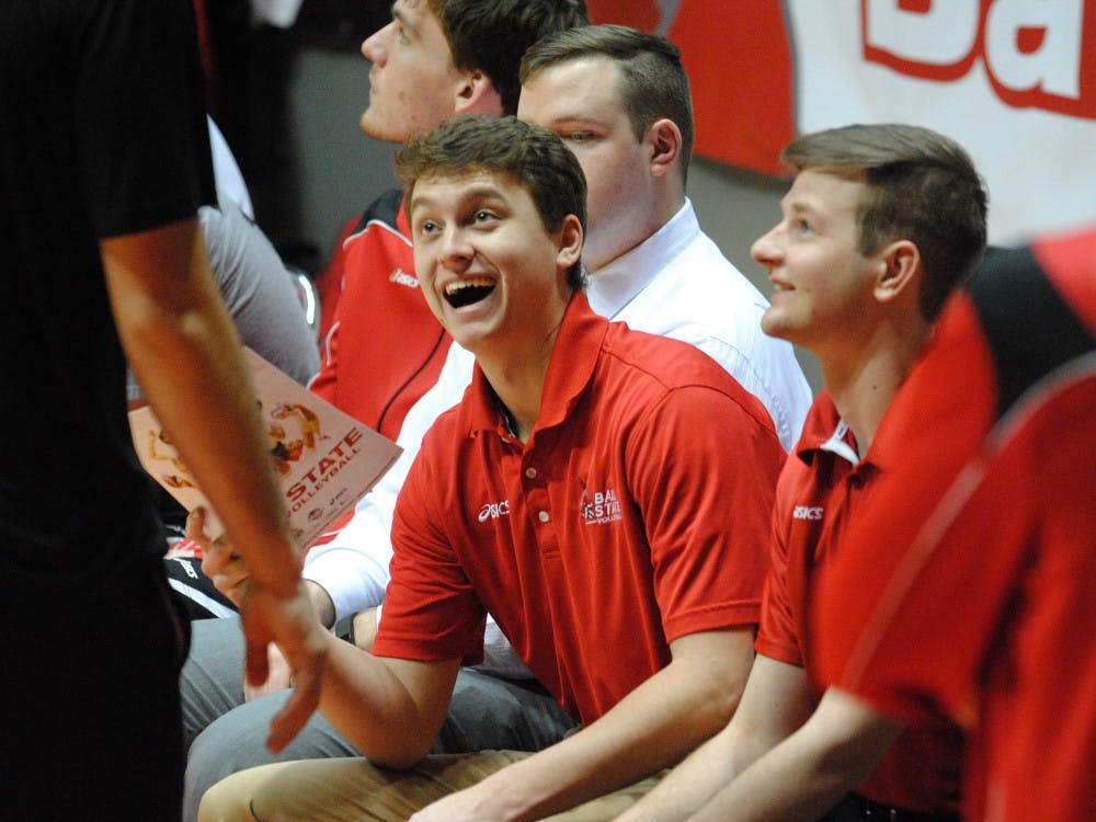 Shane Witmer laughs on the bench during a match this season. Witmer&nbsp;serves as a volunteer coach for the Ball State men's volleyball team after playing four years.&nbsp;DN PHOTO ALLISON COFFIN