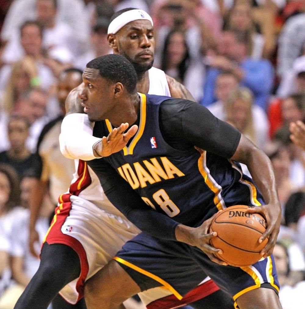 Miami Heat forward LeBron James defends against Pacers center Ian Mahinmi in the second quarter of Game 4 as the Pacers faced the Heat in the NBA Eastern Conference Finals basketball game at the AmericanAirlines Arena on May 26. MCT PHOTO