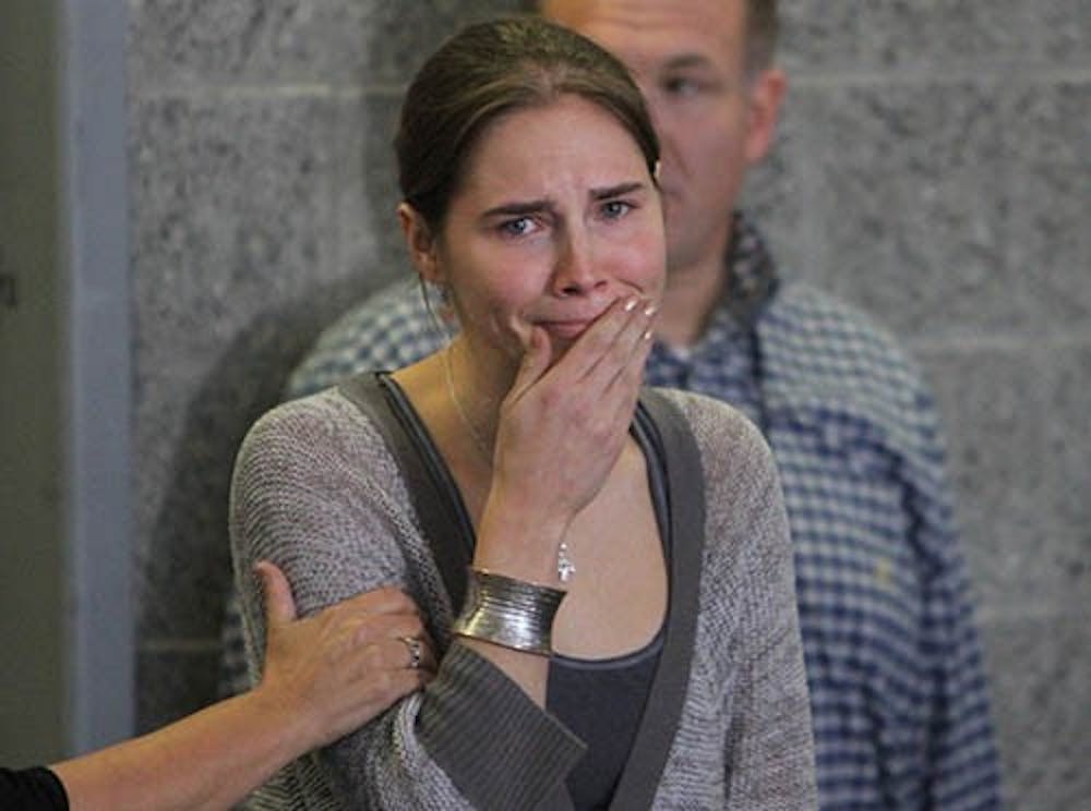 Amanda Knox, right, becomes emotional at a news conference at Sea-Tac International Airport on Oct.4, 2011, in Seattle. The case's aquittal has been overturned and will be rexamined. MCT PHOTO