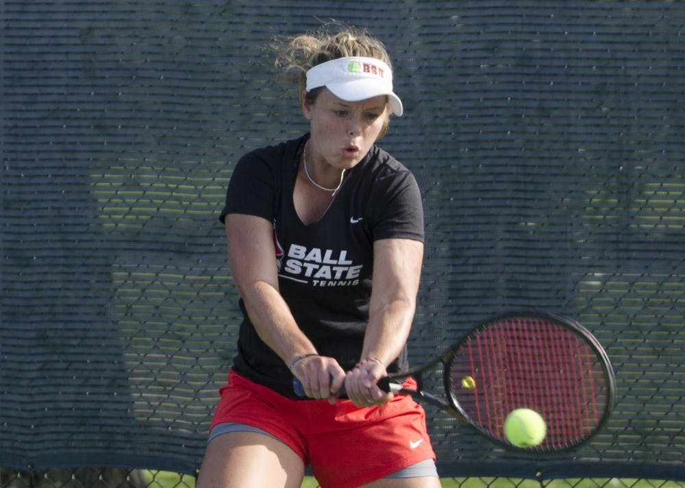 <p>Alumna Bethany Moore hits the ball during her singles match against Butler for the Fall Dual on Sept. 20, 2015 at the Cardinal Creek Tennis Center. <strong>Breanna Daugherty, DN File</strong></p>