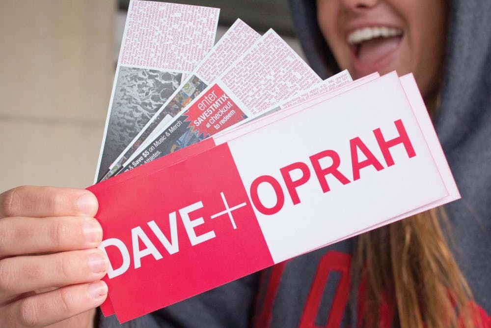 Mackenzie Newman poses with her tickets Saturday morning at the John R. Emens Auditorium Box Office. Some students who stood in line have tried to sell their tickets to Dave + Oprah for prices upward of $100. DN FILE PHOTO TAYLOR IRBY