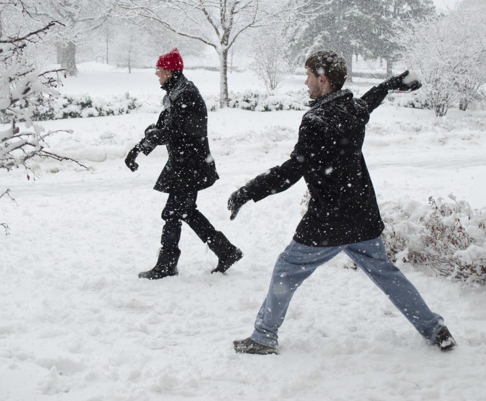 Impromptu snowball fights, snowmen and snow forts popped up on campus Monday afternoon after Sunday