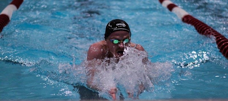 A Ball State swimmer performs the breaststroke Jan. 11 at Llewelyn pool. The team celebrated over ten seniors in their senior night festivities. Jeffrey Dreyer, DN