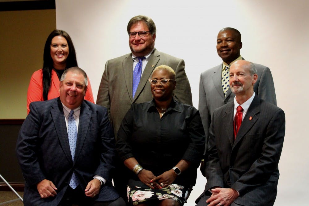 <p>The seven Muncie School Board members were selected and announced during a Board of Trustees meeting Monday, June 25. Front row, from left, are David Heeter, WaTasha Barnes Griffin and James Lowe. Back row, from left are Brittany Bales, James Williams and Keith O'Neal. Not picutred is Mark Ervin. <strong>Brynn Mechem, DN&nbsp;</strong></p>