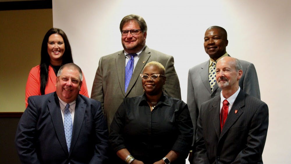 The seven Muncie School Board members were selected and announced during a Board of Trustees meeting Monday, June 25. Front row, from left, are David Heeter, WaTasha Barnes Griffin and James Lowe. Back row, from left are Brittany Bales, James Williams and Keith O'Neal. Not picutred is Mark Ervin. Brynn Mechem, DN&nbsp;