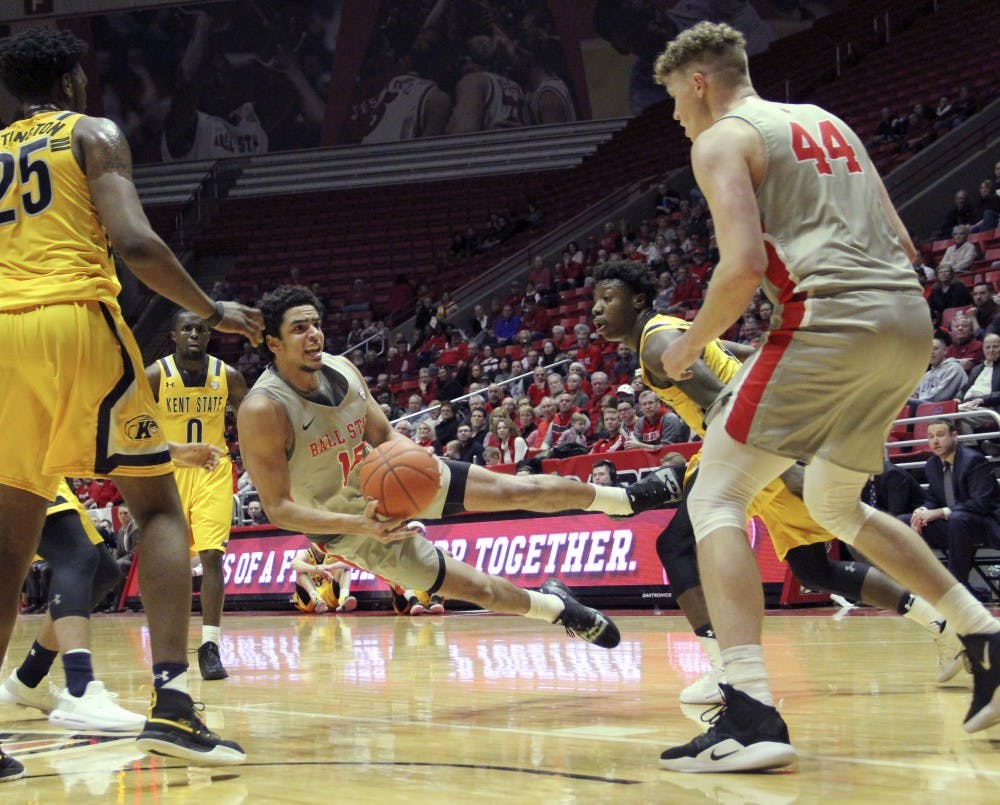 <p>Ball State sophomore forward Zach Gunn tosses the ball to redshirt freshman center Blake Huggins during the Cardinals' game against Kent State University Feb. 2, 2019 in John E. Worthen Arena. Ball State lost 80 to 83 in overtime. <strong>Paige Grider, DN</strong></p>