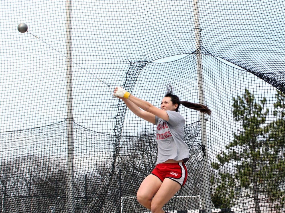 Senior Marie Lumpkin attempts to throw the hammer in a practice session on Wednesday, March 30, 2016. DN PHOTO ALLYE CLAYTON