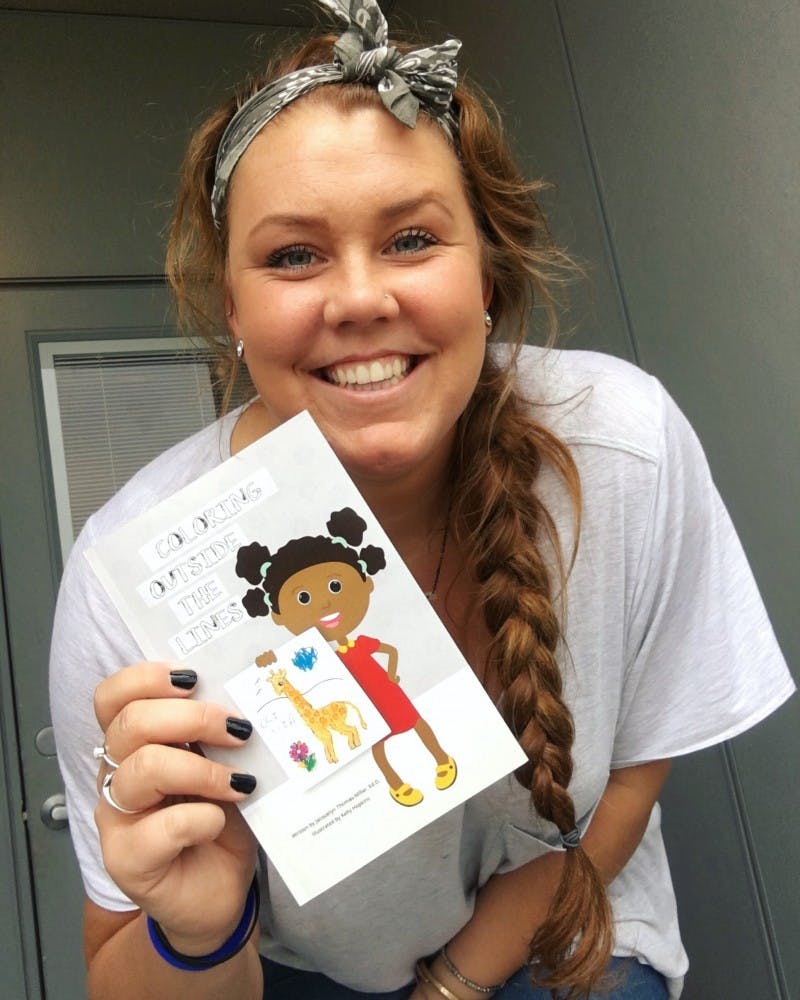 Graduate student Kelly Hopkins illustrates children's books as a side job. Hopkins teamed up with her former&nbsp;high school vice principal,&nbsp;Jacquelyn Thomas-Miller, to write and illustrate their first picture book,&nbsp;“Coloring Outside the Lines.” Kelly Hopkins // Photo Provided