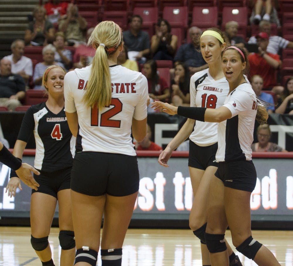The women's volleyball team celebrates after a play in the match against Western Illinois on Aug. 29 at Worthen Arena. DN PHOTO BREANNA DAUGHERTY