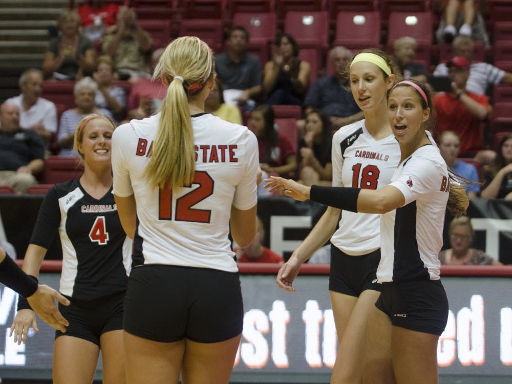 The women's volleyball team celebrates after a play in the match against Western Illinois on Aug. 29 at Worthen Arena. DN PHOTO BREANNA DAUGHERTY