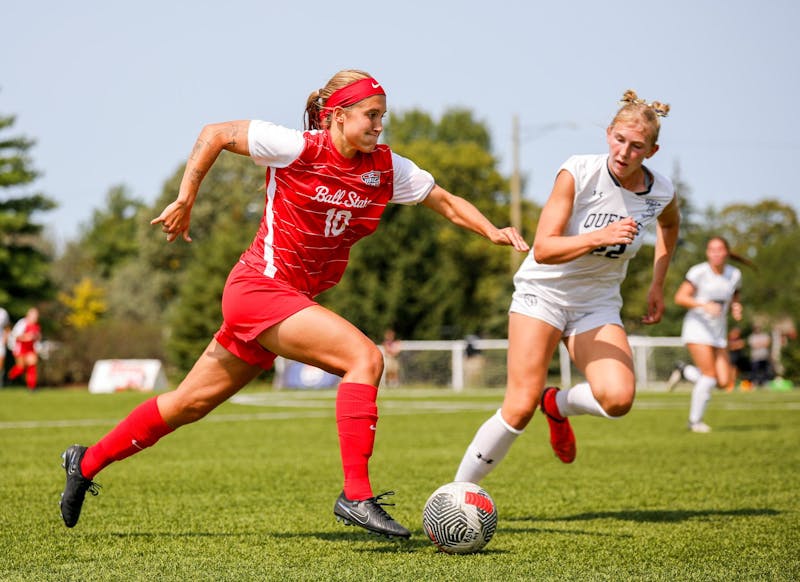 Junior midfielder Addie Chester dribbles upfield against Queens University Sept. 8 at Briner Sports Complex. Chester scored two goals in the game. Andrew Berger, DN 