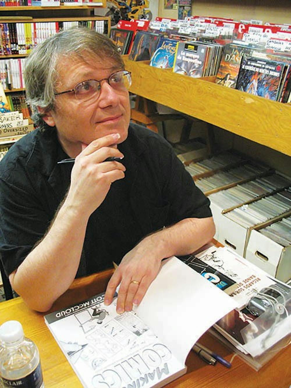 Comic book author and artist Scott McCloud signs a fan