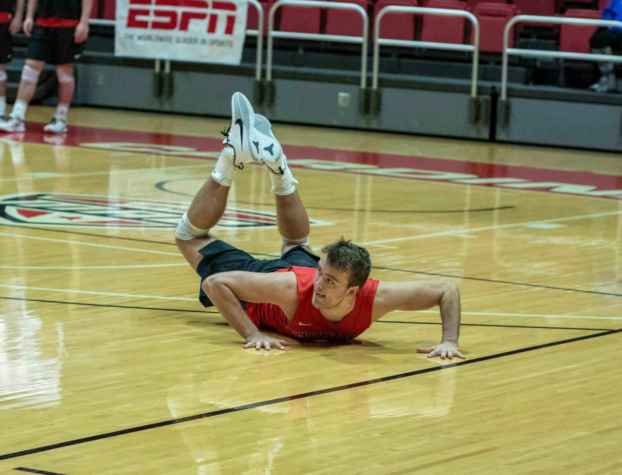 Senior outside attacker Blake Reardon after digging down to defend his team's side of the court Feb. 15, 2020, at John E. Worthen Arena. Reardon had 9 kills this game. Joshua Smith, DN