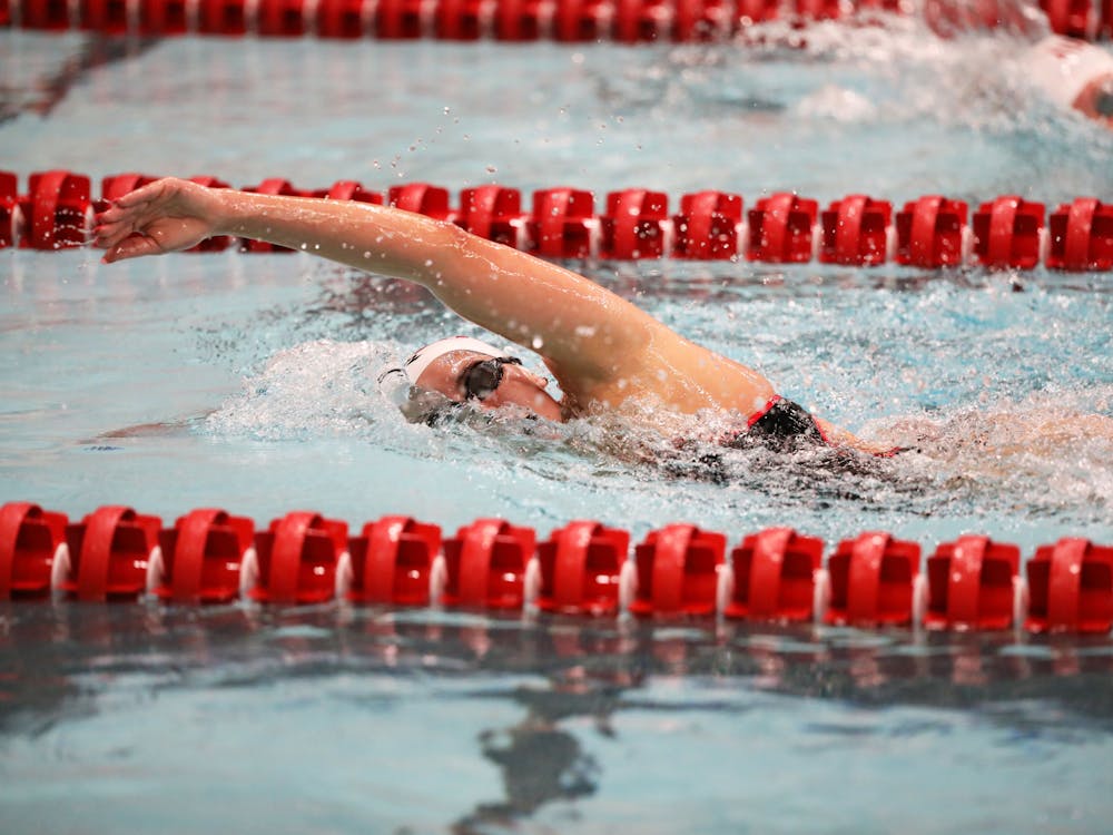 Senior Marcella Ribeiro does the freestyle stroke in a race against IUPUI Nov. 3 at Lewellen Aquatic Center. Ribeiro placed first in the women 1000 free stroke race. Mya Cataline, DN