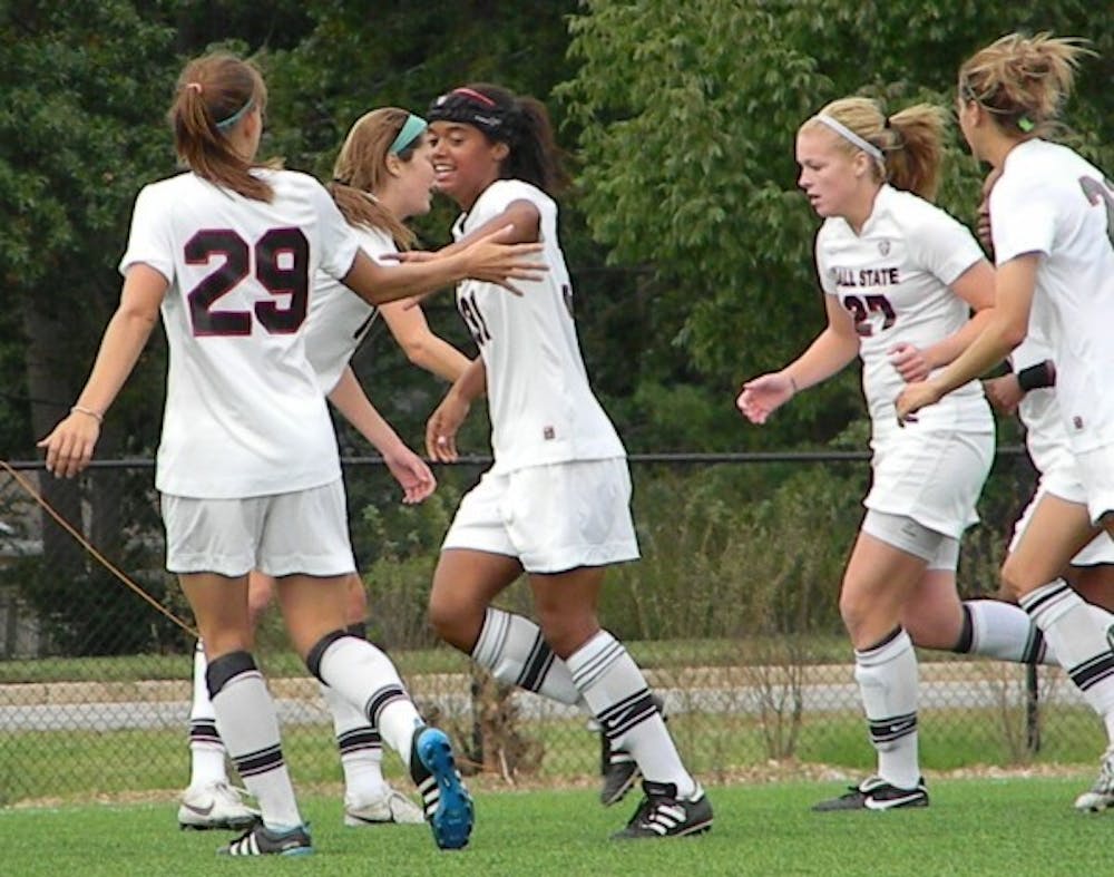 Freshman Jasmine Moses celebrates with friends after scoring a goal late in the game against Marshall. DN PHOTO SHAE GIST