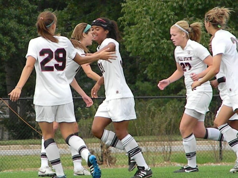 Freshman Jasmine Moses celebrates with friends after scoring a goal late in the game against Marshall. DN PHOTO SHAE GIST