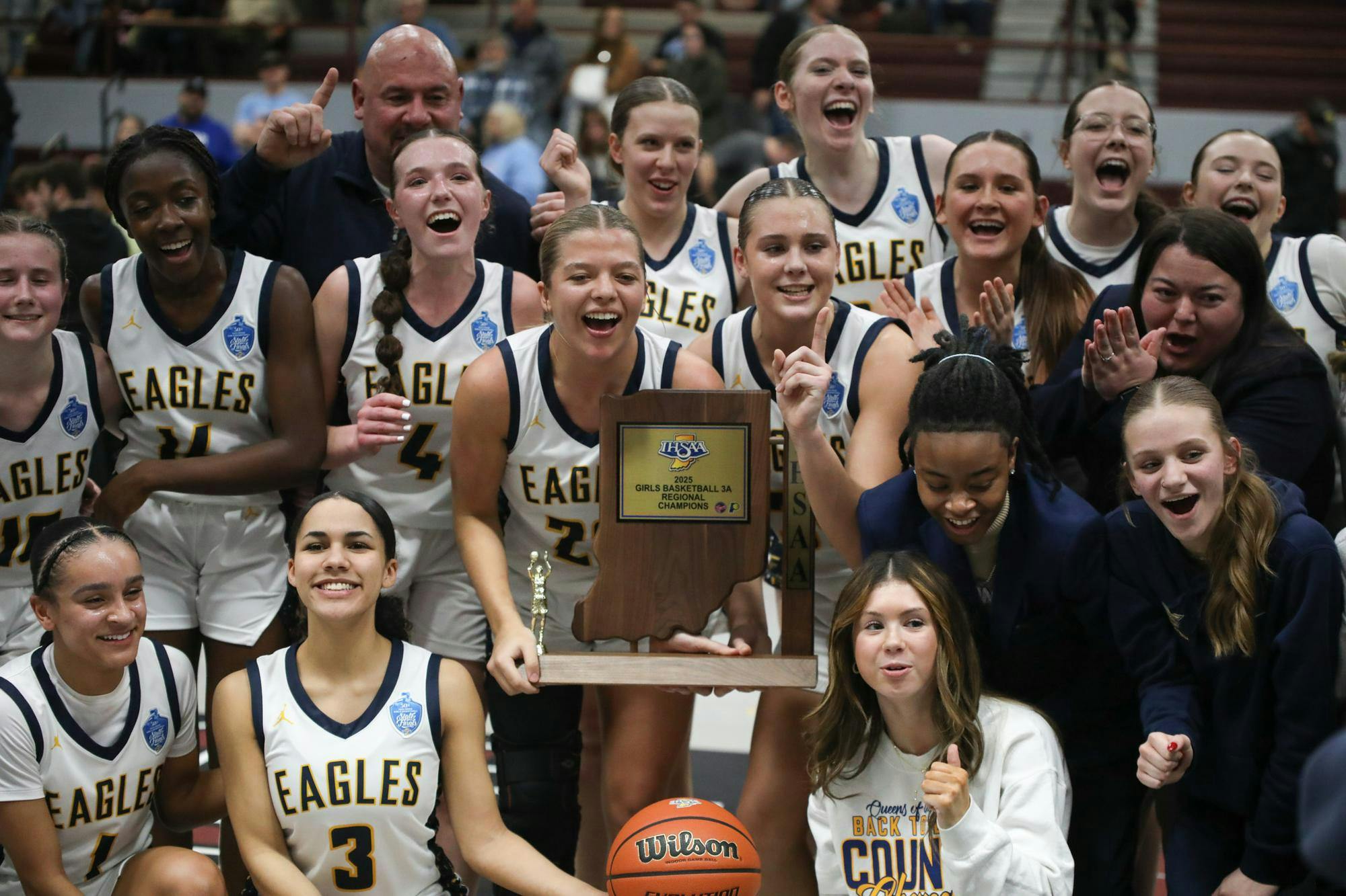 Delta girls basketball poses with the trophy Feb. 15 after winning the regional championship game over Maconaquah at Wes-Del Middle/High School. This is the Eagles' first regional title in school history. Zach Carter, DN. 