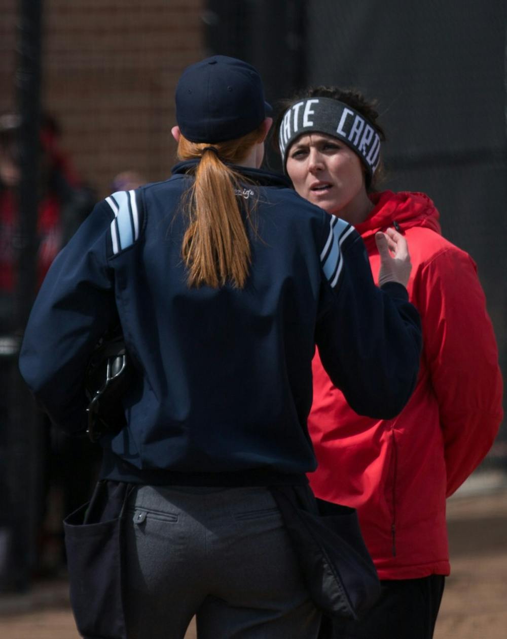 <p>Head Coach Megan Ciolli Bartlett talks with an umpire after a call in the fifth inning during the Cardinals' game against Kent State April 7 at the Softball Field at First Merchants Ballpark Complex. <strong>Eric Pritchett, DN</strong></p>