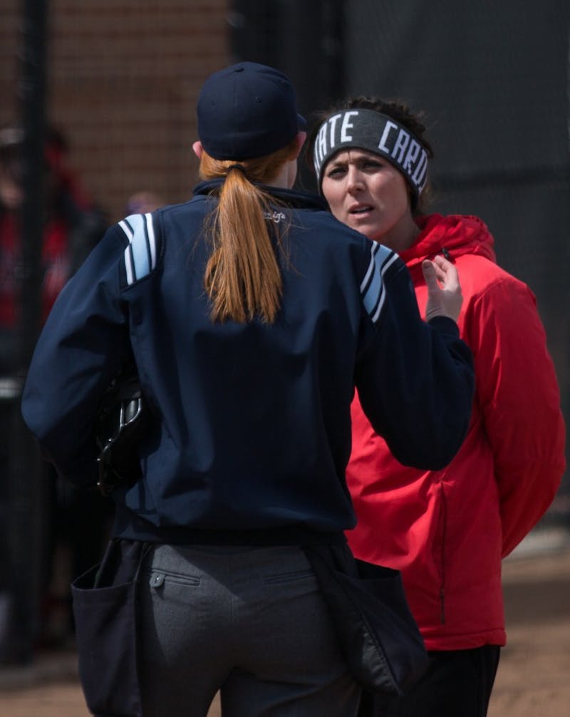 Head Coach Megan Ciolli Bartlett talks with an umpire after a call in the fifth inning during the Cardinals' game against Kent State April 7 at the Softball Field at First Merchants Ballpark Complex. Eric Pritchett, DN