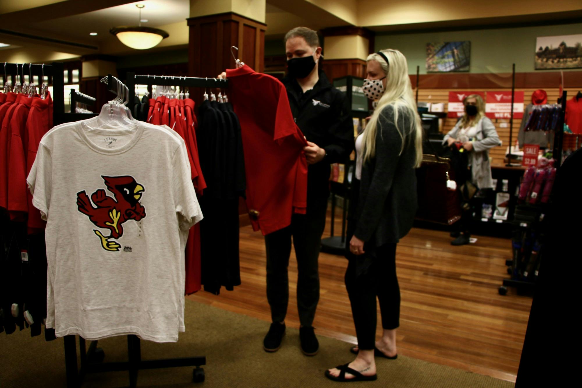 Ty Garrison and Haylie McCracken, 2015 Ball State alumni, browse the bookstore in the Arts and Journalism Building June 2, 2021. Orientation guests eat in the Atrium during their lunch break and can buy university apparel in the bookstore. Grace McCormick, DN