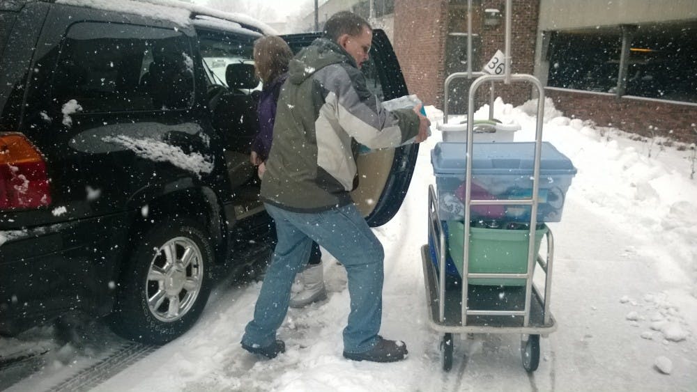 Junior Kylie Pine and her father Bob Elliott move in to Park during the snow. Pine and Elliott didn't encounter much difficulty on their way to Muncie from the south side of Indianapolis.