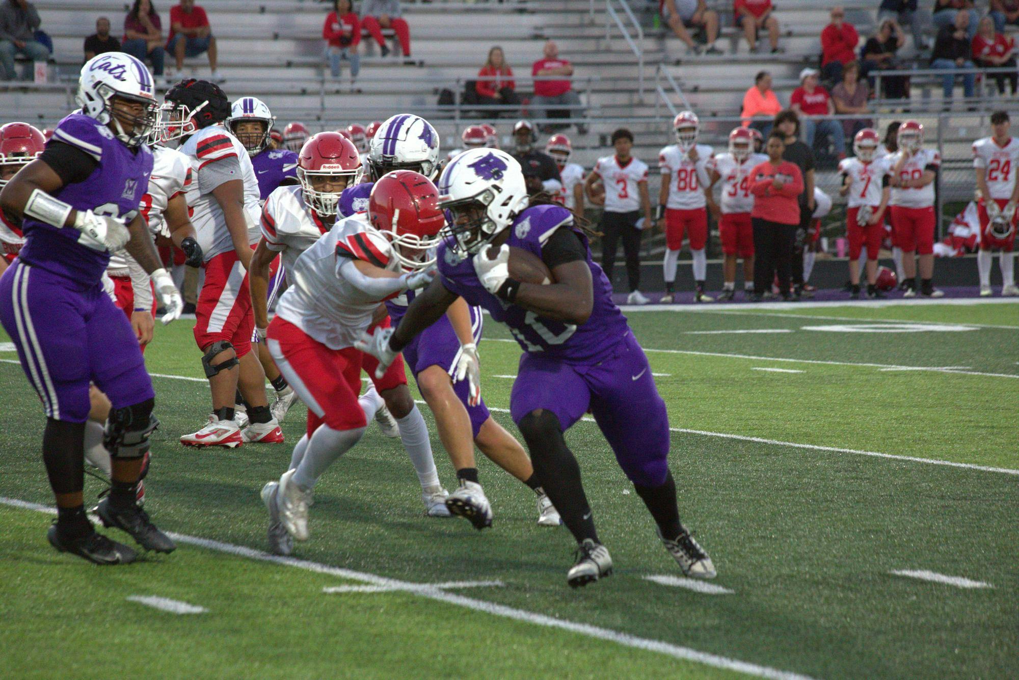 Central’s #10 Dae’Cion Echols stiff arms a defender to break off a huge run. Echols and the Bearcat offense will aim to get back to having a winning record versus Anderson next Friday at 7 PM. PHOTO BY CHRIS MCCALLA. 
