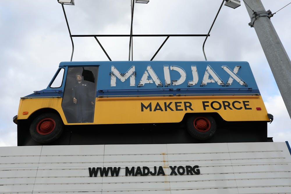 The Madjax sign sits on the corner of South Madison and East Jackson streets. Madjax Maker Force was originally called Gearbox Muncie: A Maker Hub, but the name changed in 2016 to better reflect the mission of the space. Rylan Capper, DN 