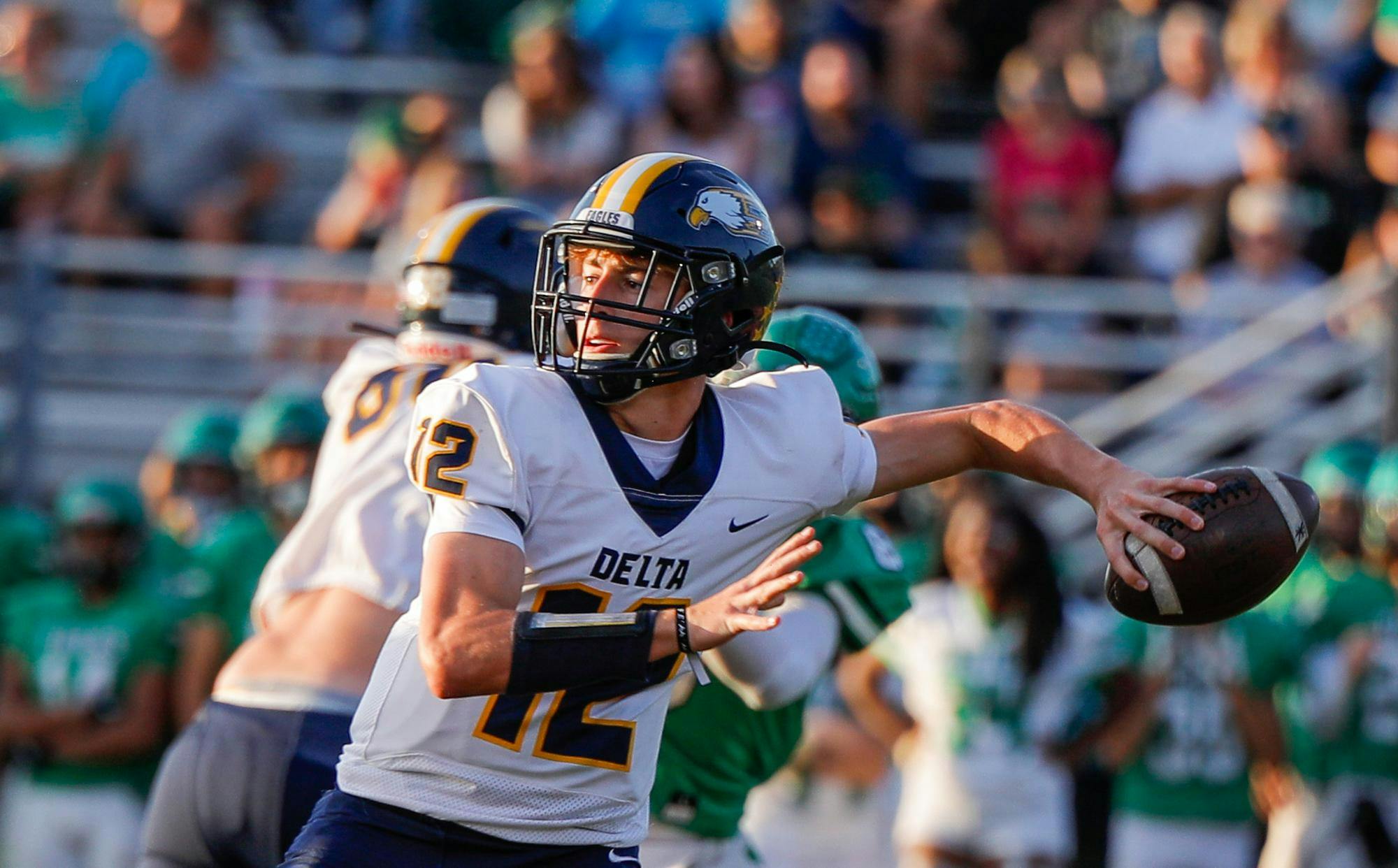 Senior quarterback Bronson Edwards throws the ball against Yorktown Sept. 13 at Yorktown High School. Andrew Berger, DN