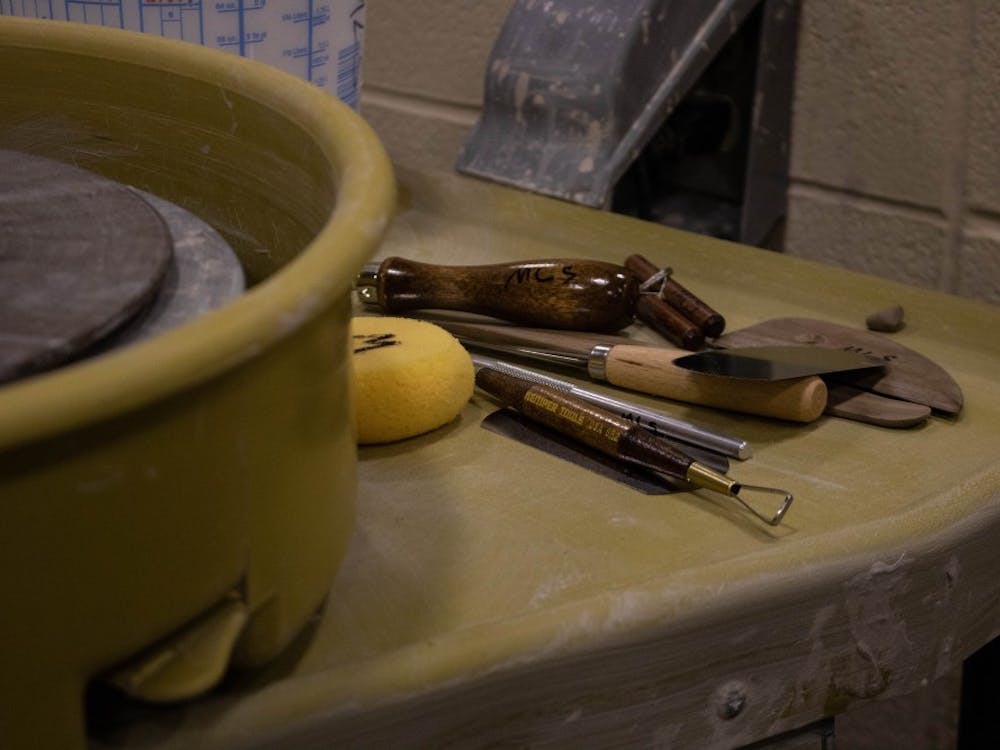 Tools students use to shape clay sit on the back of the pottery wheel Wednesday, Aug. 22, 2018 in the Arts and Journalism Building room 225.  Two students in this semester's class have never handled clay before. Tier Morrow, DN