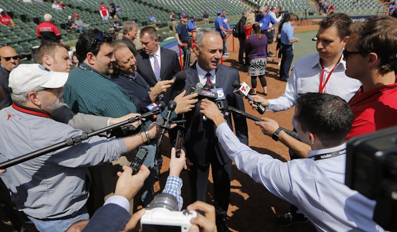 Rob Manfred, commissioner of Major League Baseball, talks with reporters as the Houston Astros play the Texas Rangers on opening day of Major League Baseball at Globe Life Park Thursday, March 29, 2018 in Arlington, Texas. (Rodger Mallison/Fort Worth Star-Telegram/TNS) 