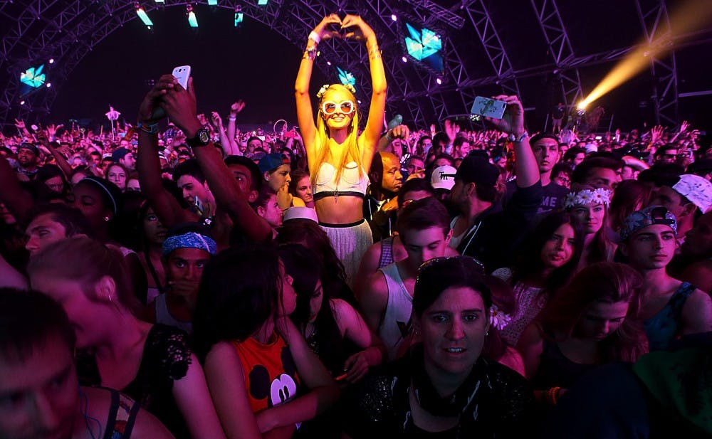 Fans of Empire of the Sun watch the show during the opening night of Coachella on April 11 in Indio, Calif. MCT PHOTO