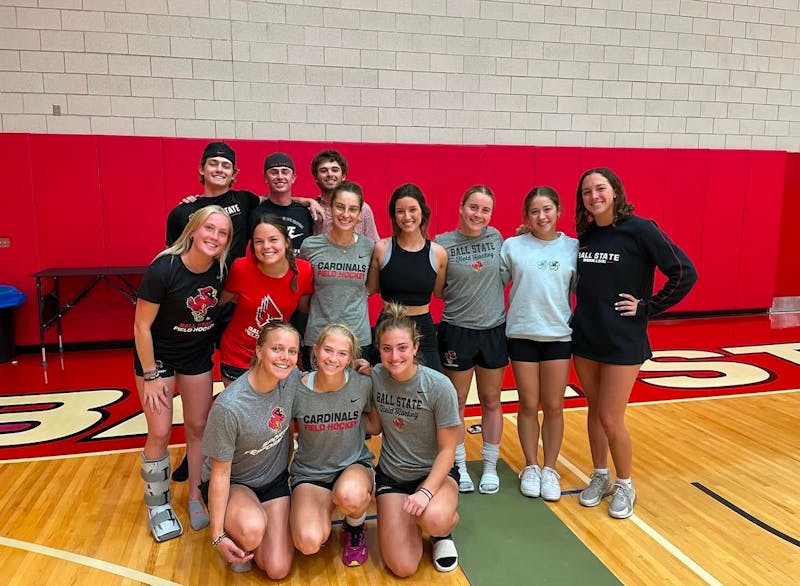 Several student-athletes pose for a picture during a "Morgan's Message" a yoga session Oct. 21, 2024 in Muncie, Ind. With guests like Ms. Indiana, and Ball State University Alumni, Kalyn Melham, this time was used to raise awareness during mental health awareness week. Provided by Emma Hilton