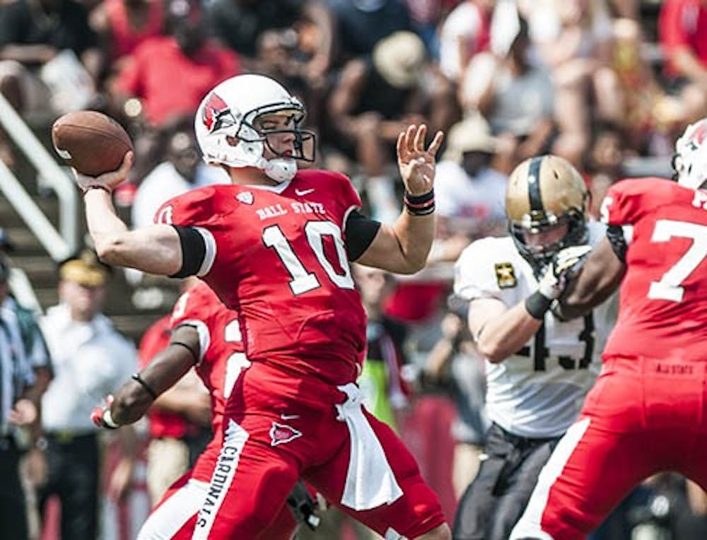 Senior quarterback Keith Wenning prepares to pass the ball downfield against Army on Sep 7. DN PHOTO JONATHAN MIKSANEK