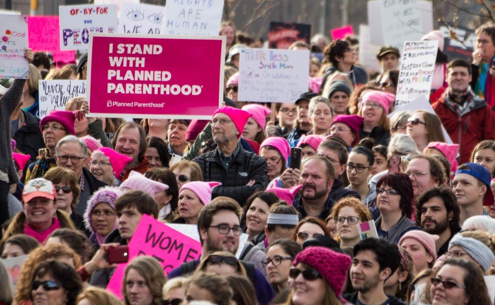 An estimated 4,500 to 5,000 people gathered outside the Indiana Statehouse on Jan. 21 for the Indianapolis Women's March, according to Indiana State Police. The rally was held in conjunction with hundreds of marches nationwide to support women's rights and protest the presidency of Donald Trump. Grace Ramey // DN