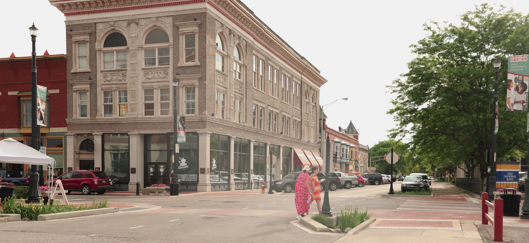 Pedestrians cross the street in downtown Muncie June 3, 2021, during the First Thursdays ArtsWalk. Part of the DWNTWN &quot;Embrace the Original&quot; campaign is hosting multiple events over the summer. Lauren Clark, DN