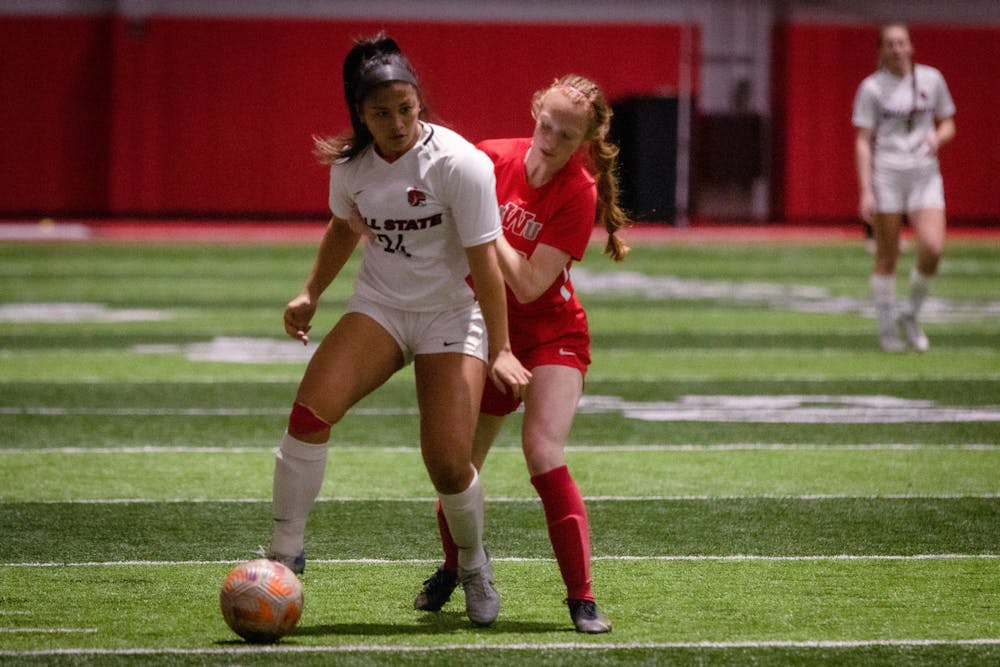 Third-year defender Paige Munar dribbles the ball in a game against Indiana Wesleyan April 1 at the Indoor Practice Facility. Meghan Sawitzke, DN