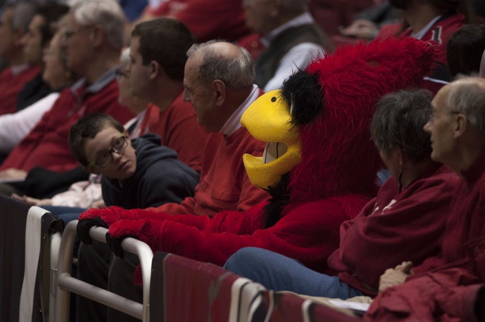 Watching the basketball game with fans, Charlie Cardinal sits and follows the basketball game from the stands. Ball State University played against Bowling Green on Saturday, Feb. 14. DN PHOTO Jason Conerly