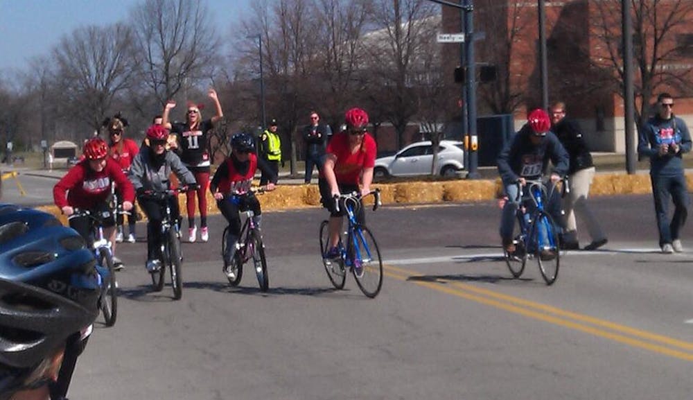 Cyclists begin the 1-mile Benny Dash race at McKinley Mile. Cyclists will race in the Cardinal Relay at 2 p.m. today.