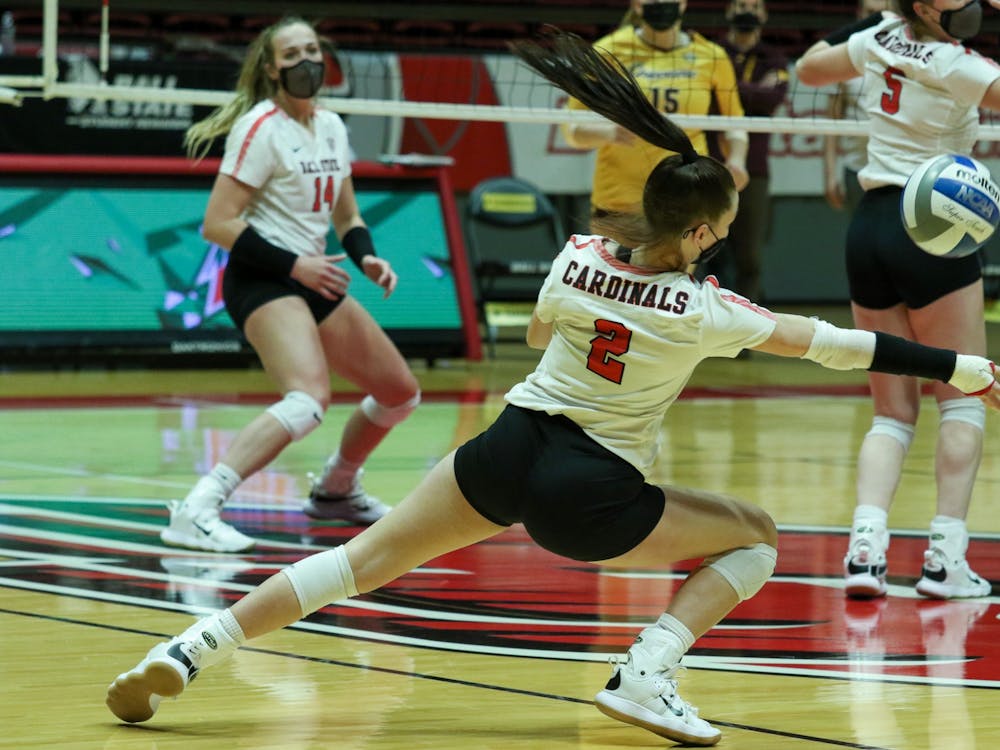 Freshman defensive specialist Kate Vinson saves the ball. The Cardinals fell to the Chippewas 3-1. Gabi Kramer, DN
